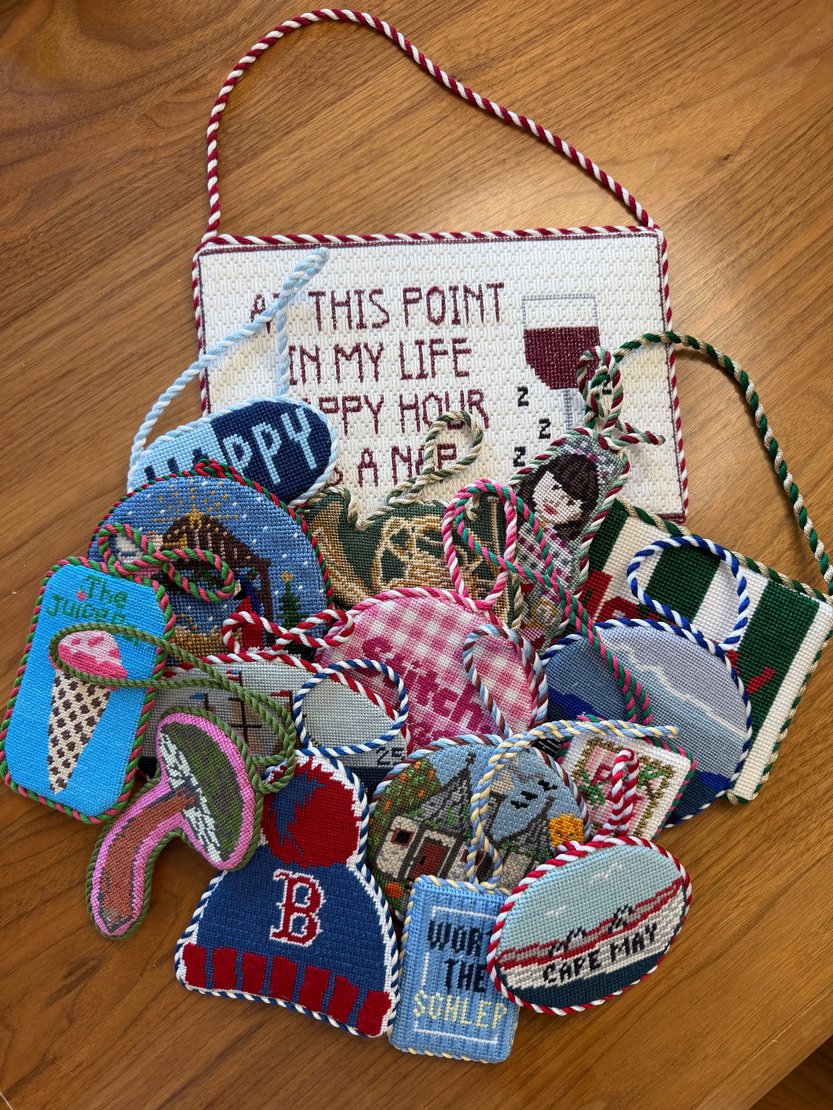Finished needlepoint ornaments on display